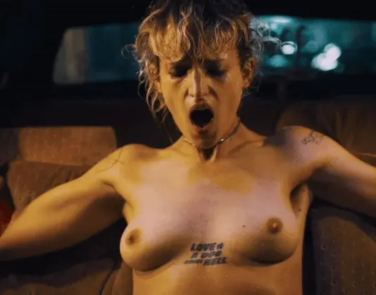 Agathe Rousselle railed by a car in Titane (2021)