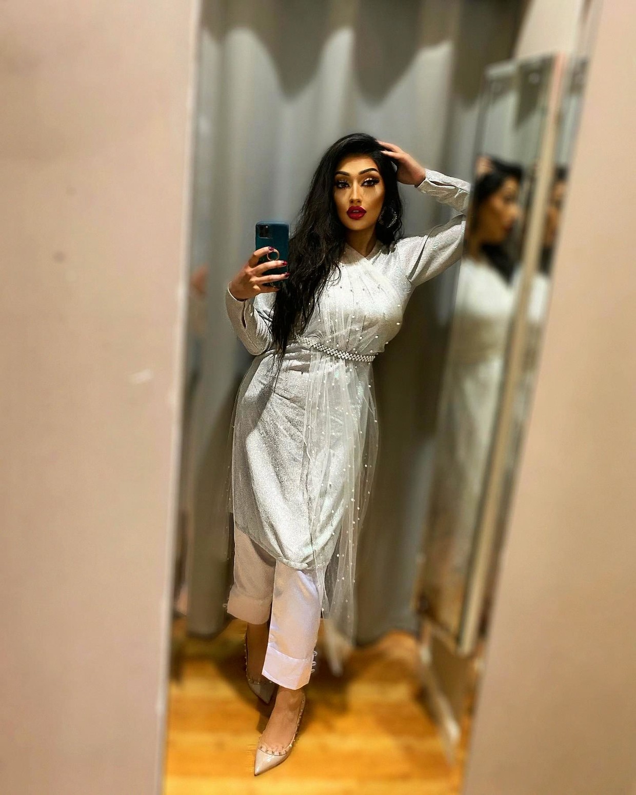 Dressed up, posing as a Indian sissy. ^^