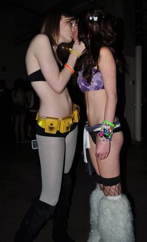 Cute raver-chicks enjoying a kiss