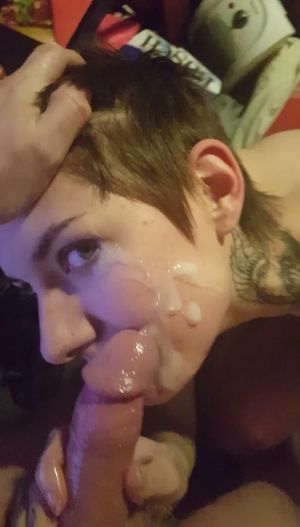 Short-haired amateur brunette getting a facial from an average-sized dick