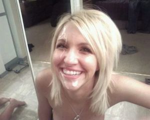 Smiling blond amateur with her face covered in cum