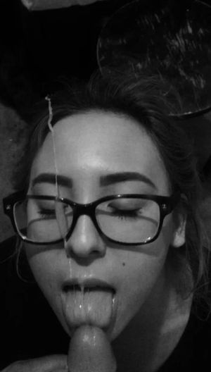 Brunette amateur with glasses taking a cumload on her face