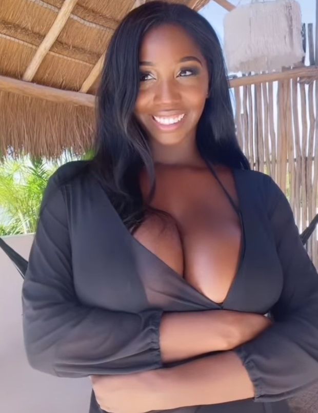 Ellie Mae black bikini looking left