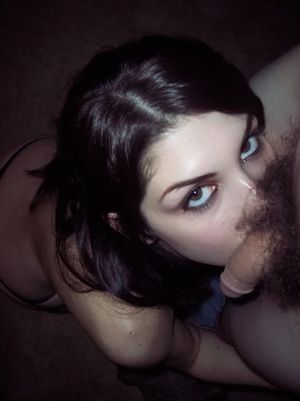 Brunette amateur with sexy eyes giving head to get a dick hard