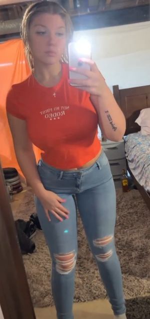 Destiny orange top selfie