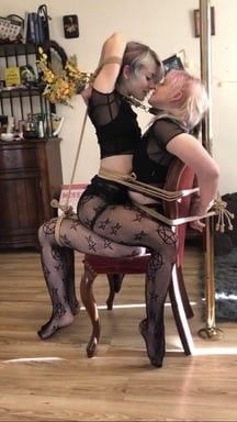 Two women bound together on a chair, via reddit user Knottydevil