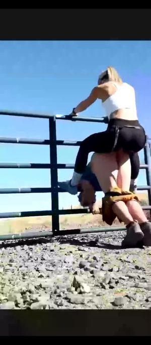 Sissy bitching and getting railed by his wife on a fencegate.
