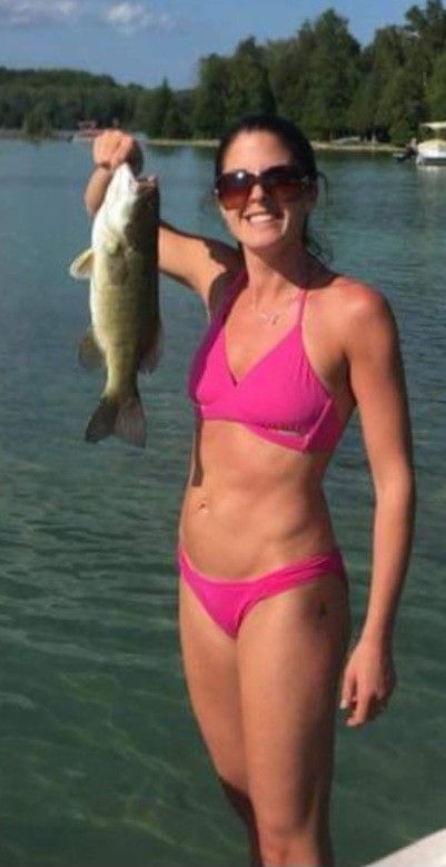 Keri in pink bikini with fish