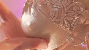 Vana playing with her satin covered nipple
