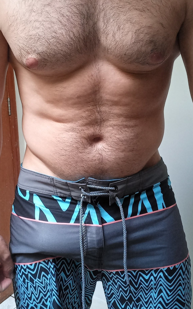 Tight swim trunks bulge