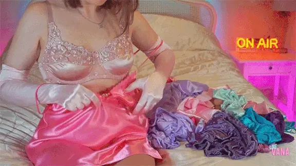 Vana putting on her satin chemise