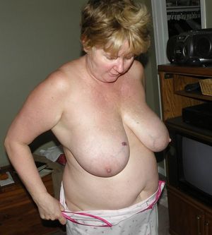 Sexy mum undressing for bed