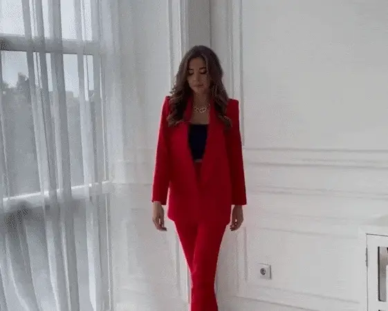 Immaculate brunette beauty presenting her sexy red suit outfit