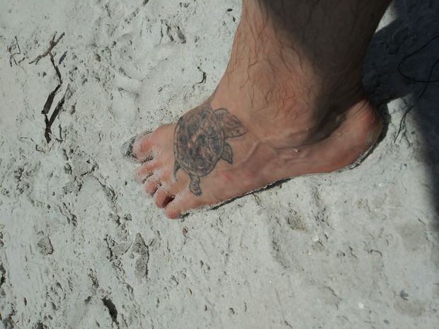 Nude foot on beach...