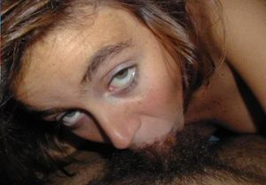 Blue-eyed amateur brunette sucking balls deep on a cock