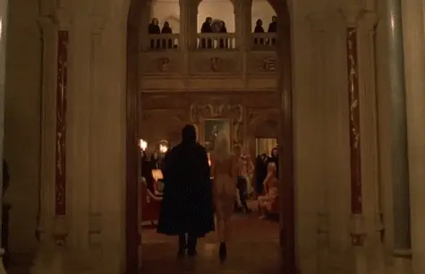 Delightful blonde servant leading her companion through a room filled with lots of perversive fun - Eyes Wide Shut orgy