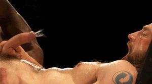 giving himself a mouth facial