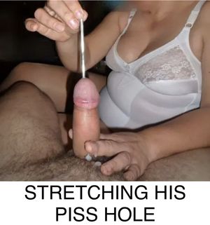 Sounding his cock with a stainless probe