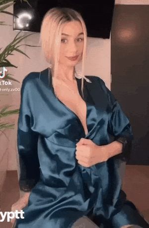 blonde rips off her clothes