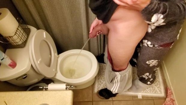 Hold his cock while he pisses