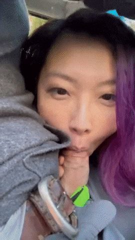 Asian takes a selfie giving roadhead