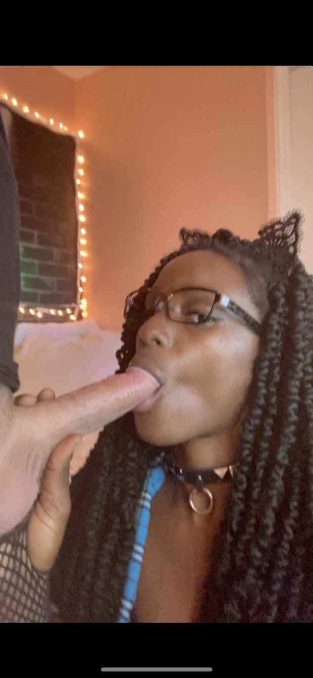 Amateur black chick with glasses sucking a long white cock