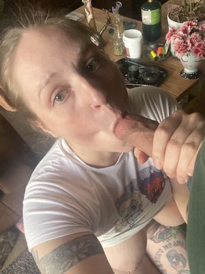 Amateur tattooed brunette sucking some cock