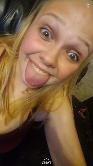 Riley Bull sticking out her tongue