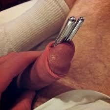 Two sounding rods inside his cock