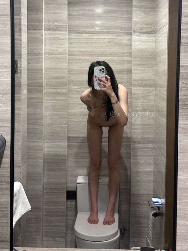 Naked woman in bathroom