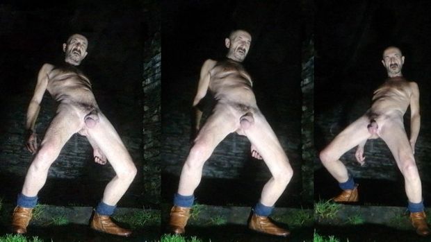 Guy posing nude in public park