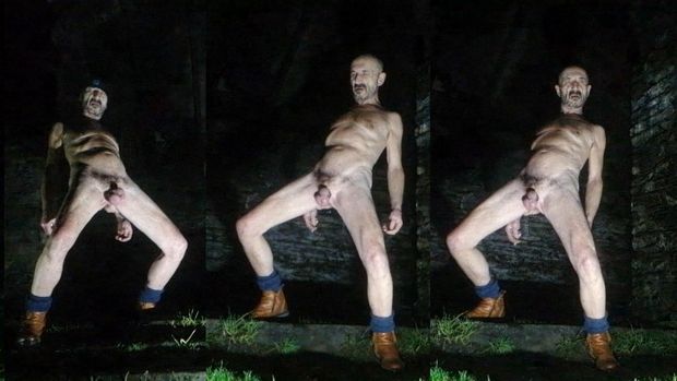 Guy posing naked in public park