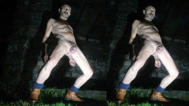 Guy posing nude in public park