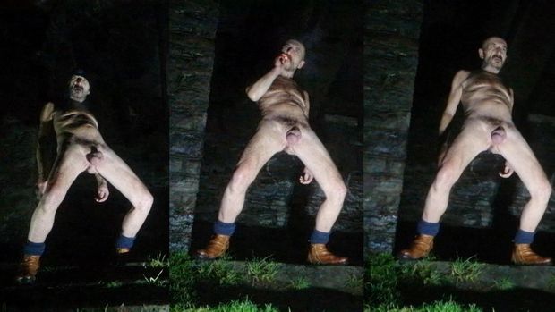 Guy posing nude in public park