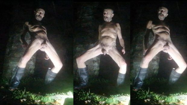 Guy posing naked in public park