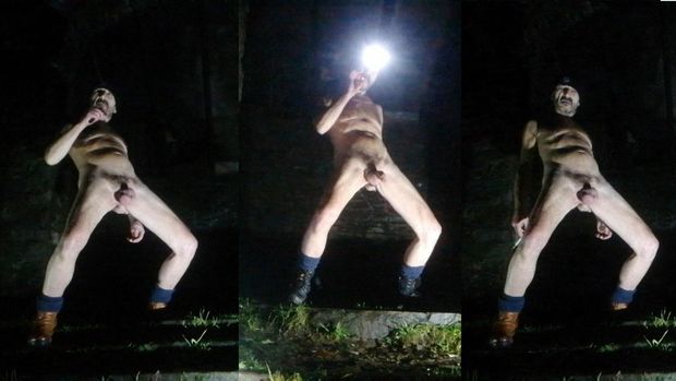 Guy posing nude in public park