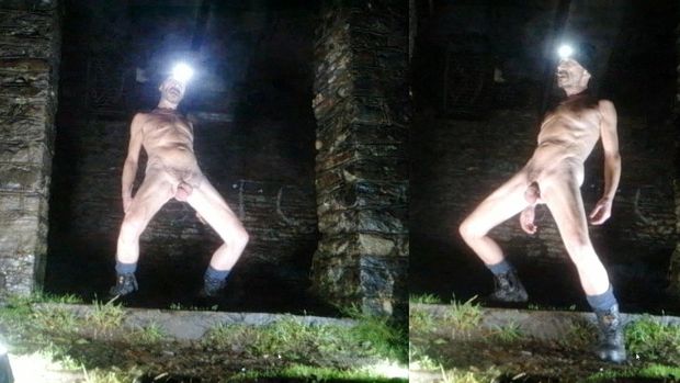 Guy posing nude in public park