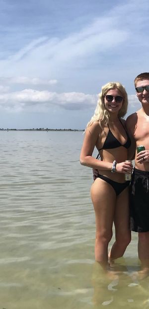 Whitney and her husband smile at the black men coming their way