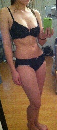 Sexy brunette girlfriend shows off petite body