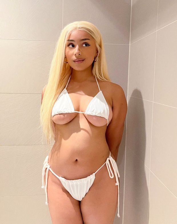 Sexy underboobs showing in white loose bikini on hot thick Latina with bleached hair maybe part light skinned ebony hot gemini g*rl lil