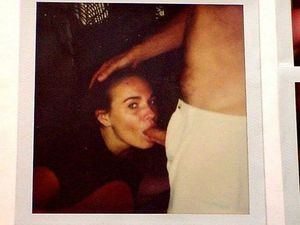 Polaroid of an amateur brunette sucking on some cock