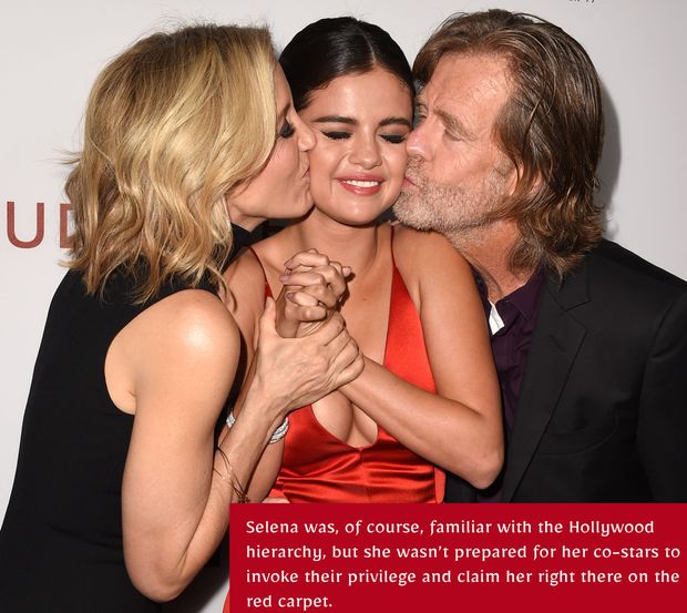 Selena gets sandwiched on the red carpet