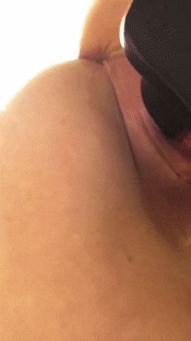 Pulling her toy from her dripping pussy