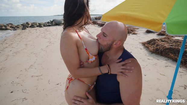 getting a mouthful of Lilly Hall's big titty on the beach
