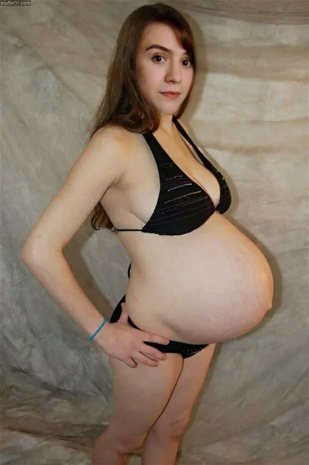 Pregnant milf posing