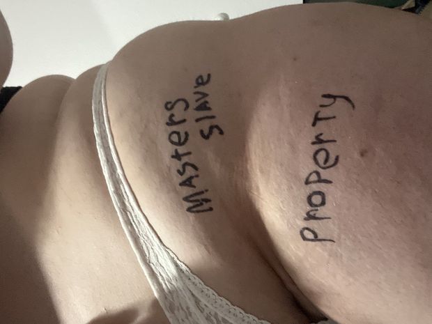 The slut’s first time doing body writing for her owner. I think she looks prettier with it.