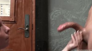 she plays with his balls but neglects his shaft as he spurts on to her face, ruining his orgasm