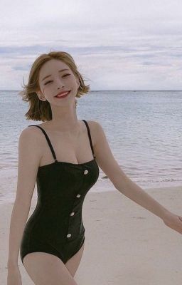 Asian babe at the beach in a one piece