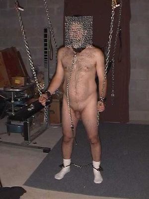 Male with small cock chained up