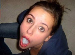 Brunette amateur showing off the load in her mouth